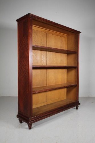 A large 19th-century mahogany open bookcase featuring diamond parquetry side panels, panelled backboards, four shelf sections, and turned feet.