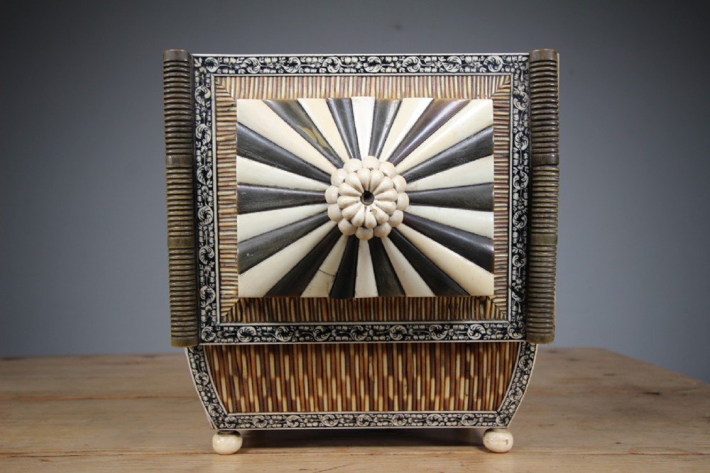 An antique sarcophagus-shaped porcupine quill box with engraved bone borders and bun feet. View IV