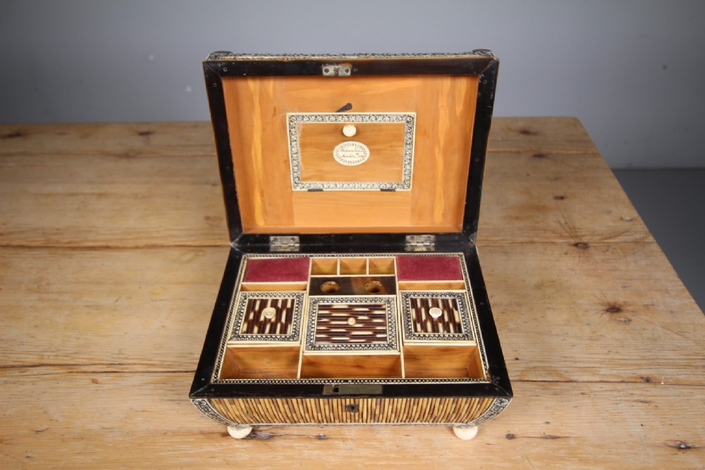 An antique sarcophagus-shaped porcupine quill box with engraved bone borders and bun feet. View VI