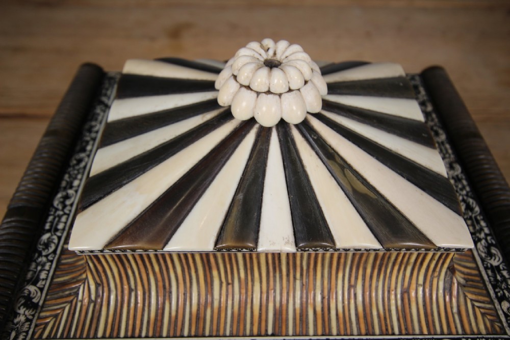 An antique sarcophagus-shaped porcupine quill box with engraved bone borders and bun feet. View X