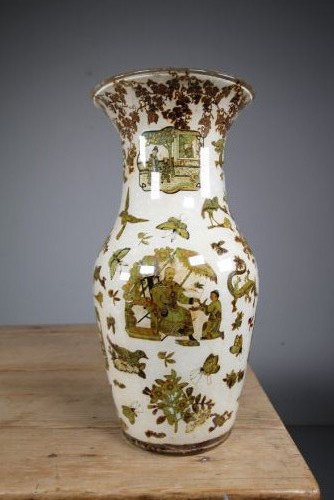 A 19th-century baluster-shaped glass vase featuring internal decalcomania imagery of figures, birds, and floral patterns against a cream background. View VII