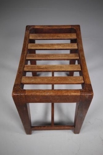 An English Georgian mahogany stool featuring a concave slatted seat, square tapered legs, and a low H-stretcher frame. View II