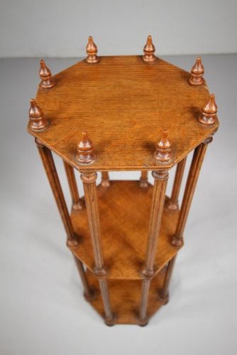 An English 19th-century oak library scroll stand featuring an octagonal structure supported by fluted vertical columns with turned finials. View III