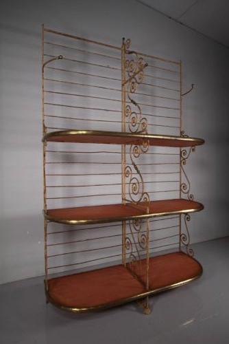 A tall 19th-century French bakers rack constructed from wrought iron with brass-rimmed shelves and scrollwork details.