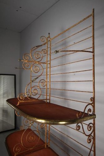 A tall 19th-century French bakers rack constructed from wrought iron with brass-rimmed shelves and scrollwork details. View XI