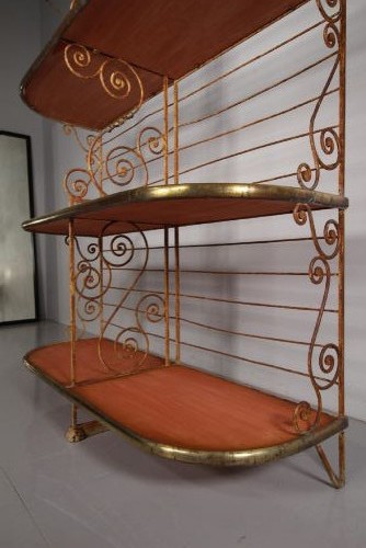 A tall 19th-century French bakers rack constructed from wrought iron with brass-rimmed shelves and scrollwork details. View X