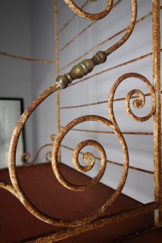 A tall 19th-century French bakers rack constructed from wrought iron with brass-rimmed shelves and scrollwork details. View VIII