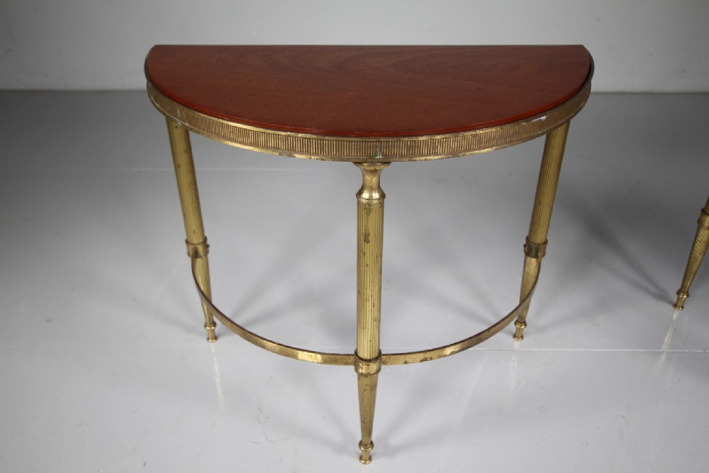 A pair of 1930s semi-circular brass side tables featuring fluted tapering legs, curved stretchers, and reeded edge aprons. View IV