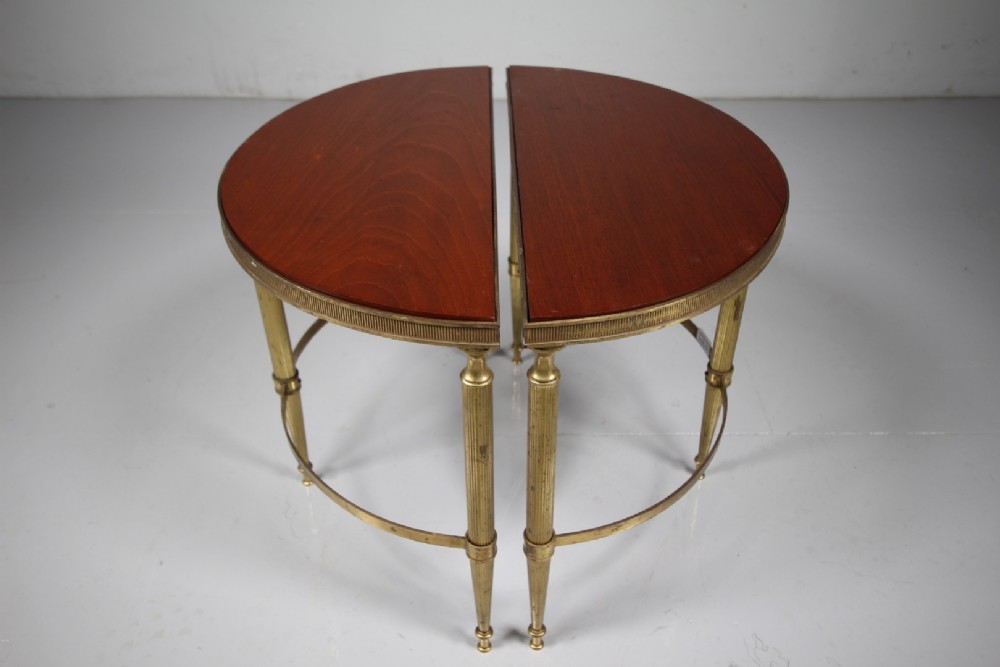A pair of 1930s semi-circular brass side tables featuring fluted tapering legs, curved stretchers, and reeded edge aprons. View VI