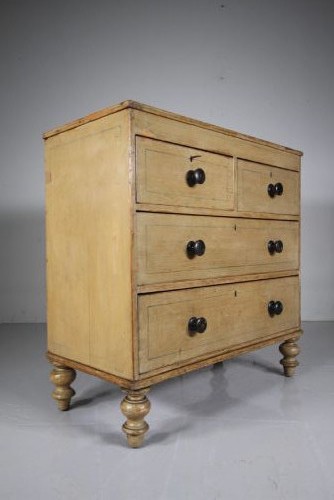 A Regency original painted pine chest of drawers featuring two short over two long drawers, turned legs, dark knobs, and hand-painted border lines. View II