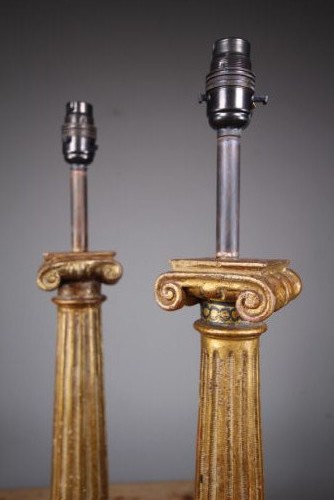 A pair of tall nineteenth-century gilt table lamps fashioned as fluted Ionic columns set on circular moulded bases. View II