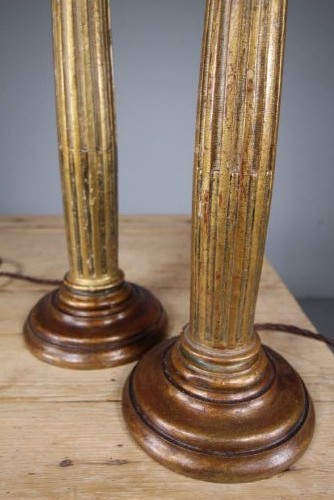 A pair of tall nineteenth-century gilt table lamps fashioned as fluted Ionic columns set on circular moulded bases. View III