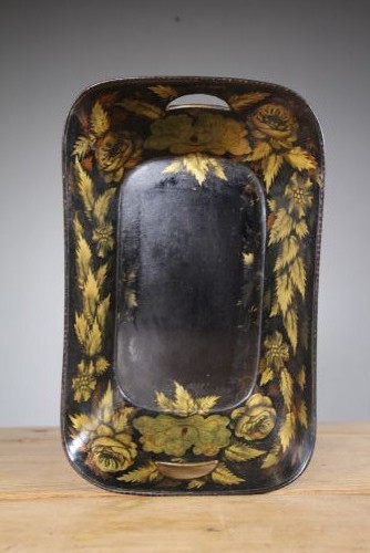 An antique black lacquered papier-mache tray featuring hand-painted gold floral borders and integrated side handles. View VI