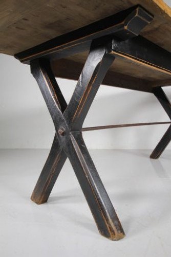 A 19th-century oak tavern dining table featuring a natural timber top, a black painted X-frame trestle base, and a central iron stretcher. View III