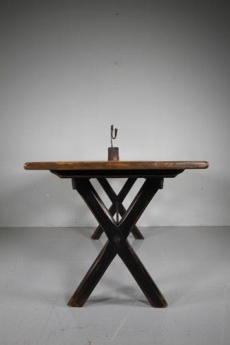 A 19th-century oak tavern dining table featuring a natural timber top, a black painted X-frame trestle base, and a central iron stretcher. View IV