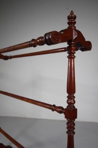A freestanding mahogany towel rail featuring turned upright columns, finials, carved scroll feet, and multiple horizontal crossbars. View II