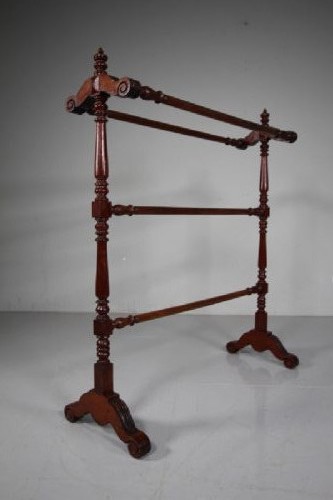 A freestanding mahogany towel rail featuring turned upright columns, finials, carved scroll feet, and multiple horizontal crossbars. View IV