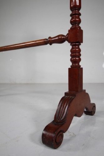 A freestanding mahogany towel rail featuring turned upright columns, finials, carved scroll feet, and multiple horizontal crossbars. View VI