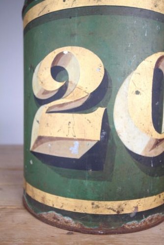 A large cylindrical nineteenth-century green painted toleware tea tin featuring decorative gold bands around the shoulder and lid. View II