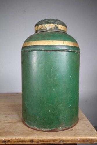 A large cylindrical nineteenth-century green painted toleware tea tin featuring decorative gold bands around the shoulder and lid. View V