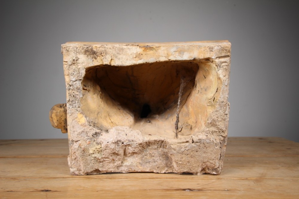 A nineteenth-century weathered buff terracotta gargoyle corbel featuring a winged beast with open jaws. View V