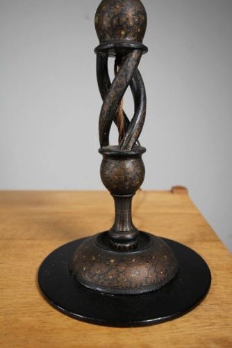 A 1920s Kashmiri carved wooden table lamp base featuring an open spiral twist column with gold foliate lacquered details on a dark circular plinth. View II