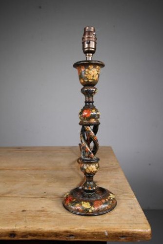 An antique Kashmiri table lamp base featuring polychrome hand-painted floral motifs on a dark lacquered ground with an open twist column and brass fitting. View III