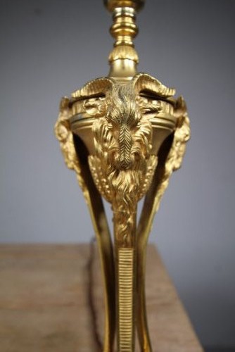 A 19th-century Neoclassical gilt bronze table lamp featuring a central urn, tri-form tripod legs terminating in rams heads, and a raised socket. View III