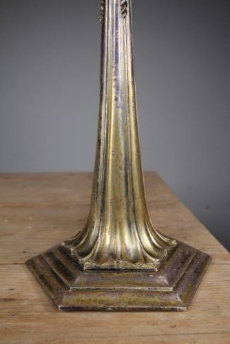 A tall antique silver-plated table lamp featuring a fluted column, classical foliate capital, and a stepped hexagonal base. View IV