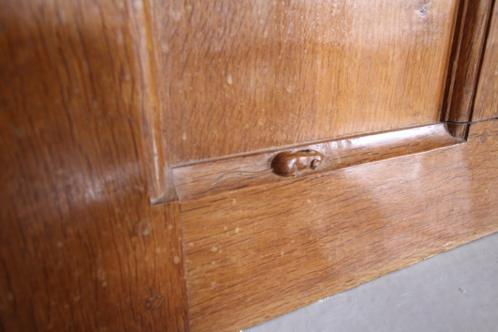 A solid oak interior door featuring ten raised panels, a hand-adzed textured finish, wrought iron latch hardware, and a carved mouse detail. View XIV