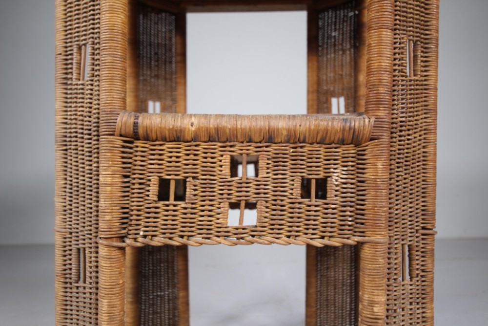 A 1920s English woven wicker side table featuring geometric openwork weave and a broad top on woven legs. View IV