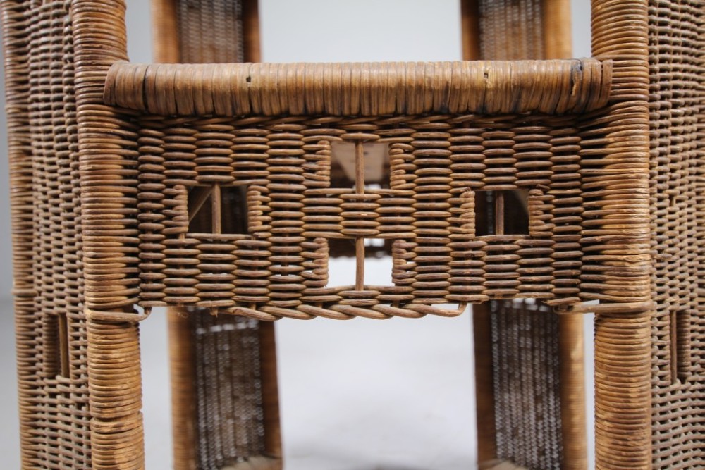 A 1920s English woven wicker side table featuring geometric openwork weave and a broad top on woven legs. View VIII