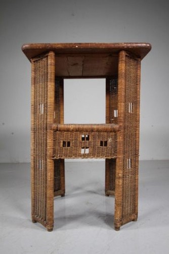 A 1920s English woven wicker side table featuring geometric openwork weave and a broad top on woven legs. View III