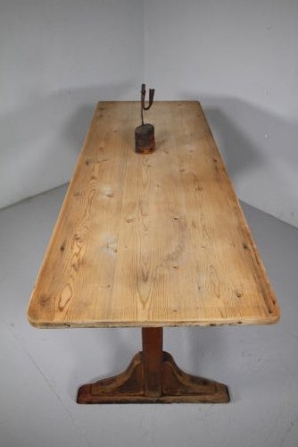An English nineteenth-century trestle tavern dining table featuring a scrubbed natural timber top and a distressed red-painted base with a stretcher. View VII