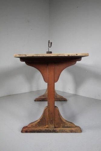 An English nineteenth-century trestle tavern dining table featuring a scrubbed natural timber top and a distressed red-painted base with a stretcher. View VI