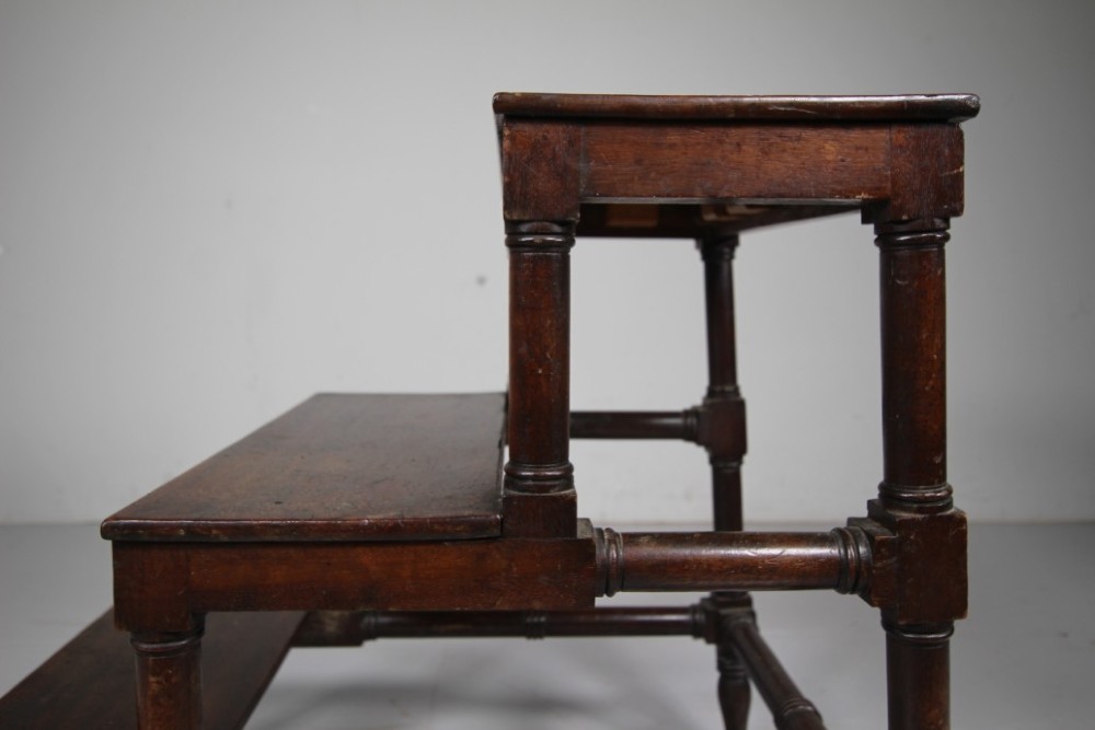 A three-tiered set of 19th-century dark mahogany library steps featuring turned legs and supporting stretchers. View IV