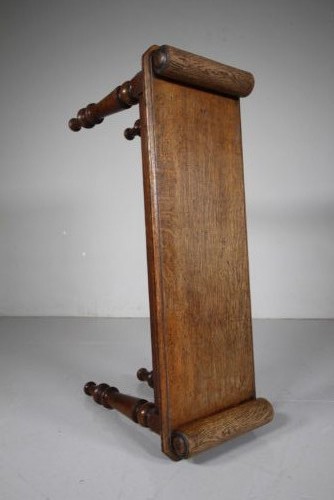 A 19th-century English oak window seat featuring cylindrical bolster armrests and four turned legs. View III