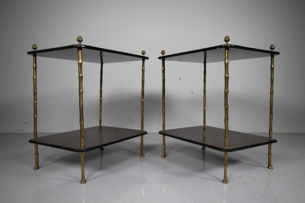 A pair of mid-century two-tier side tables with brass simulated bamboo legs and brown patterned lacquered surfaces topped with pinecone finials. View VII