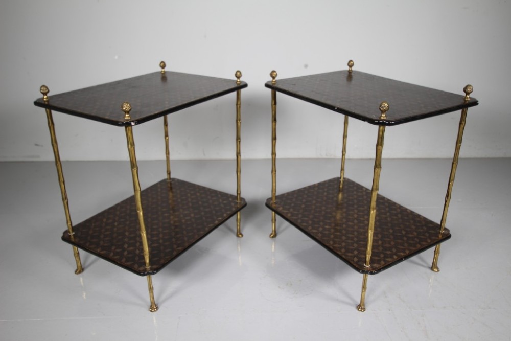 A pair of mid-century two-tier side tables with brass simulated bamboo legs and brown patterned lacquered surfaces topped with pinecone finials. View VIII