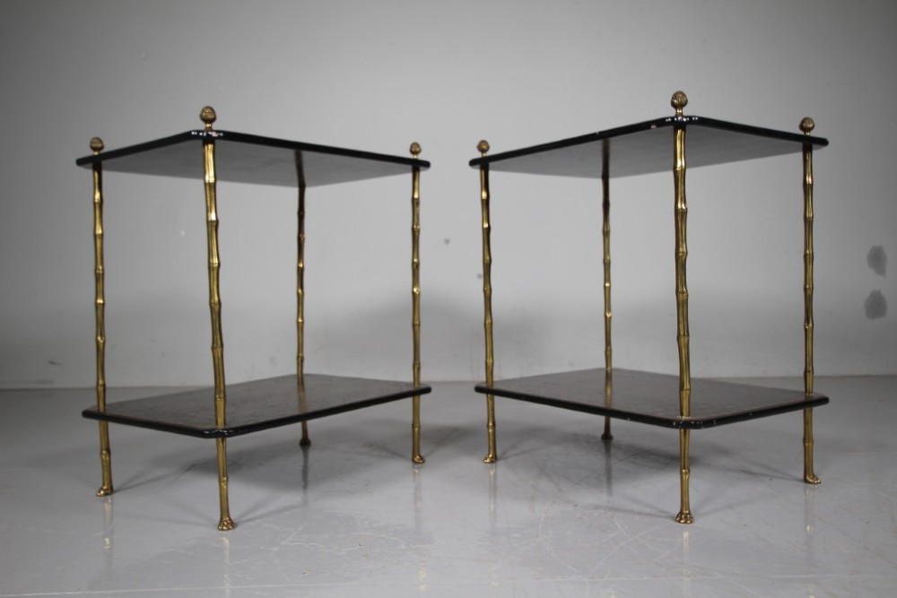 A pair of mid-century two-tier side tables with brass simulated bamboo legs and brown patterned lacquered surfaces topped with pinecone finials. View IX
