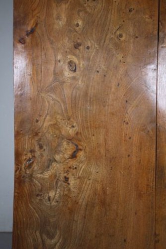 An early 19th century primitive dining table crafted from timber featuring a thick slab top and splayed legs. View VII