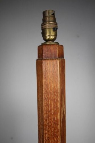 A 1930s Arts and Crafts solid oak standard floor lamp featuring a tapered octagonal column and a stepped octagonal base. View III