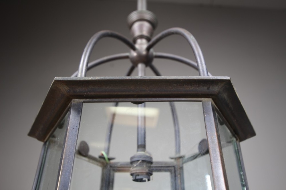 A 19th-century dark bronze hexagonal hallway lantern featuring glazed glass side panels, a domed cage top, and a central hanging stem. View IV