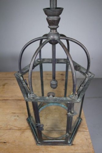 A 19th-century dark bronze hexagonal hallway lantern featuring glazed glass side panels, a domed cage top, and a central hanging stem. View VII