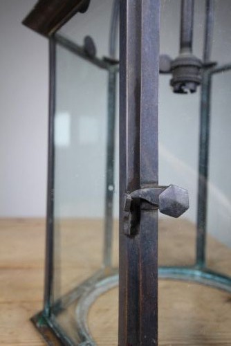 A 19th-century dark bronze hexagonal hallway lantern featuring glazed glass side panels, a domed cage top, and a central hanging stem. View V