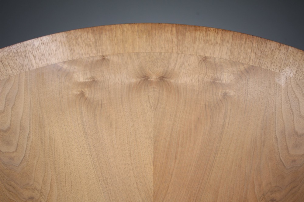 An English Art Deco circular dining table crafted from light timber with a veneered top supported by a curved four-leg pedestal base and cross stretcher. View VIII
