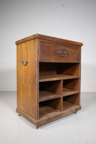 A 19th-century oak bedside cabinet with a single top drawer, brass carrying handles, and open lower pigeonhole shelves. View III