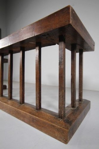 A 19th-century solid oak club fender featuring vertical spindle supports, a flat top wooden seat, and open return ends. View VI