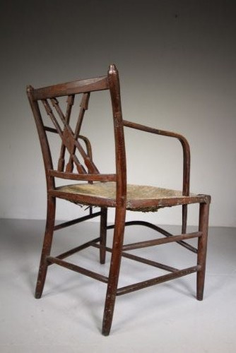 A dark brown painted Georgian Yealmpton armchair featuring a woven rush seat and an X-frame back splat. View IV