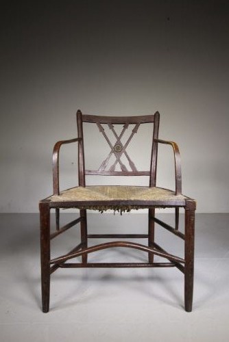 A dark brown painted Georgian Yealmpton armchair featuring a woven rush seat and an X-frame back splat. View VI